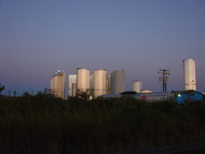 chemical tanks at sunrise
